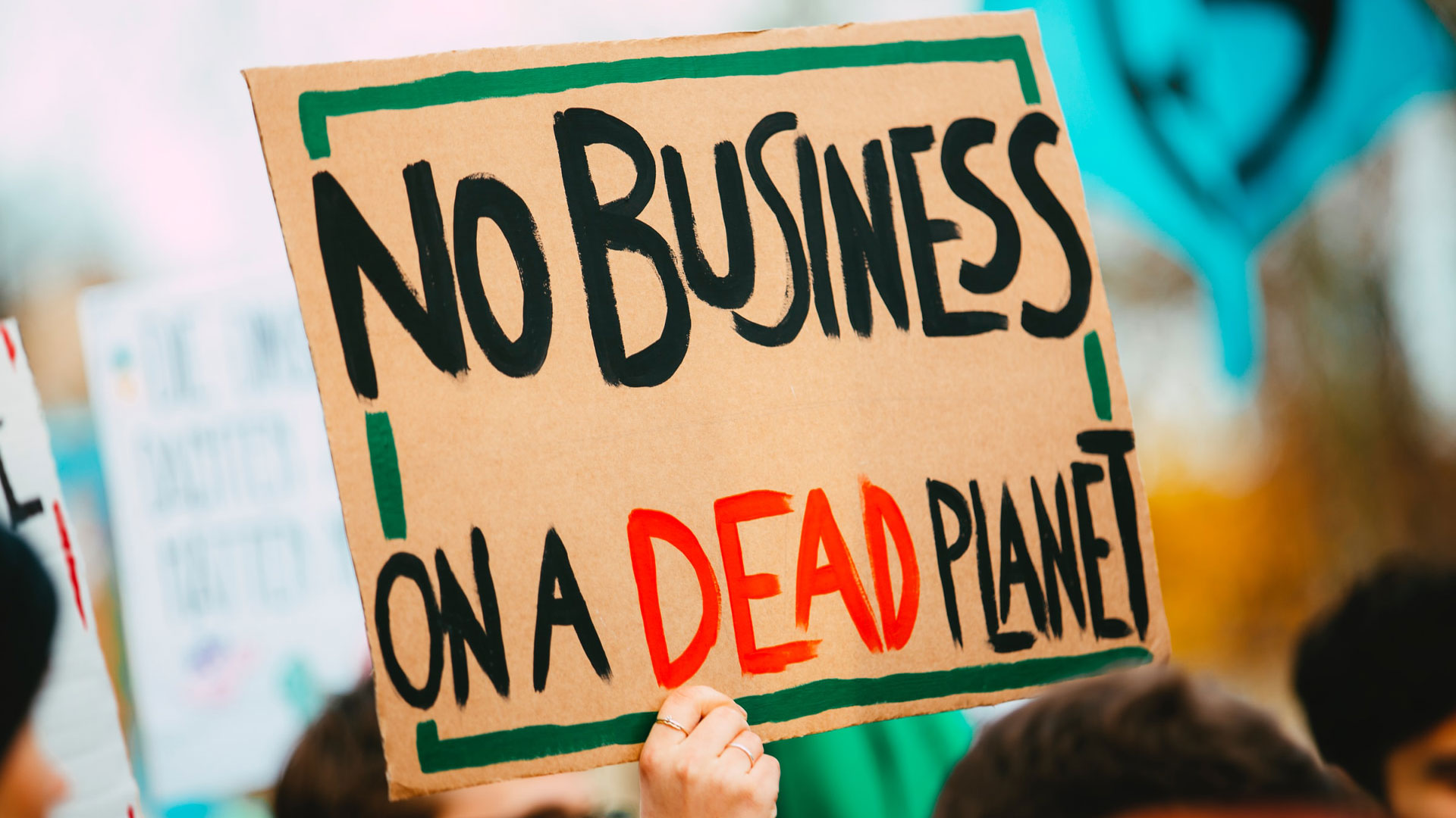 Cartaz a dizer No Business on a Dead Planet