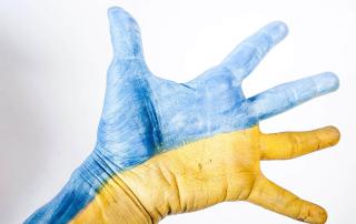 open hand with color of Ukrainne flag