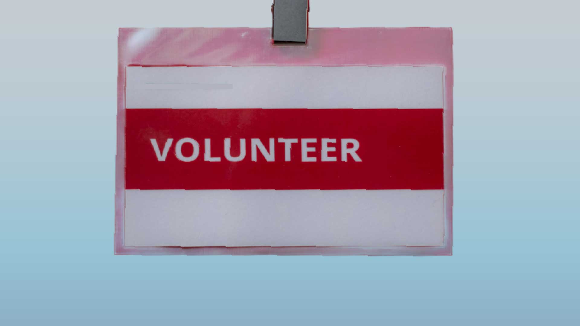 cartão a dizer Volunteer